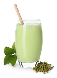 Photo of Fresh mung bean juice in glass, seeds and green leaves isolated on white