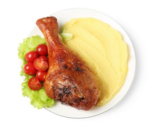 Photo of Baked turkey drumstick with mashed potato and tomatoes isolated on white, top view