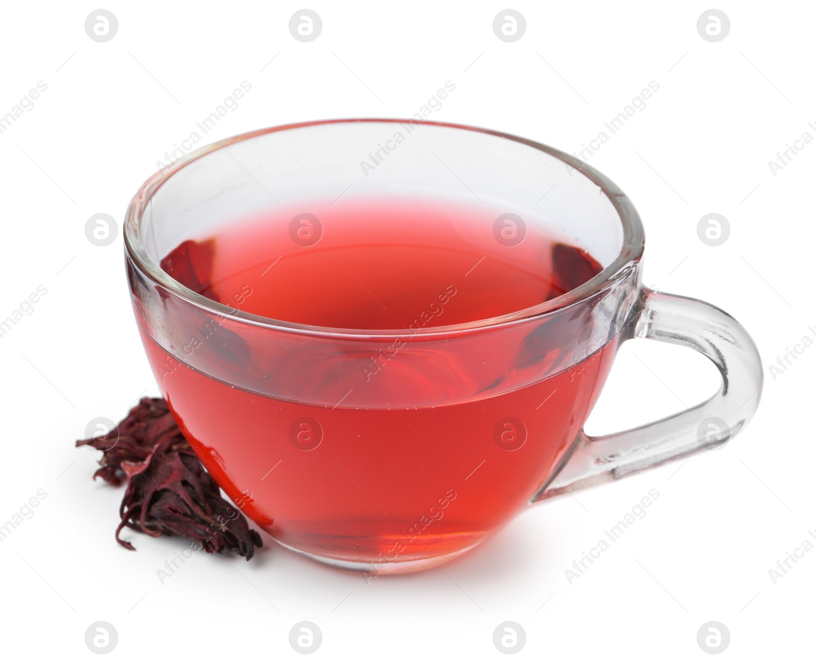 Photo of Delicious hibiscus tea in glass cup and dry roselle sepals isolated on white