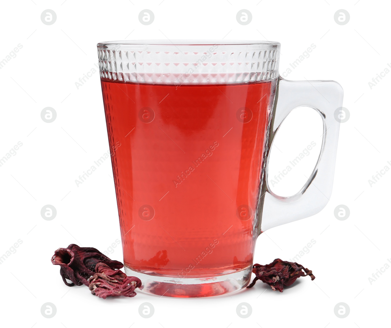 Photo of Delicious hibiscus tea in glass cup and dry roselle sepals isolated on white