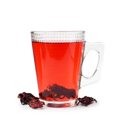 Photo of Delicious hibiscus tea in glass cup and dry roselle sepals isolated on white