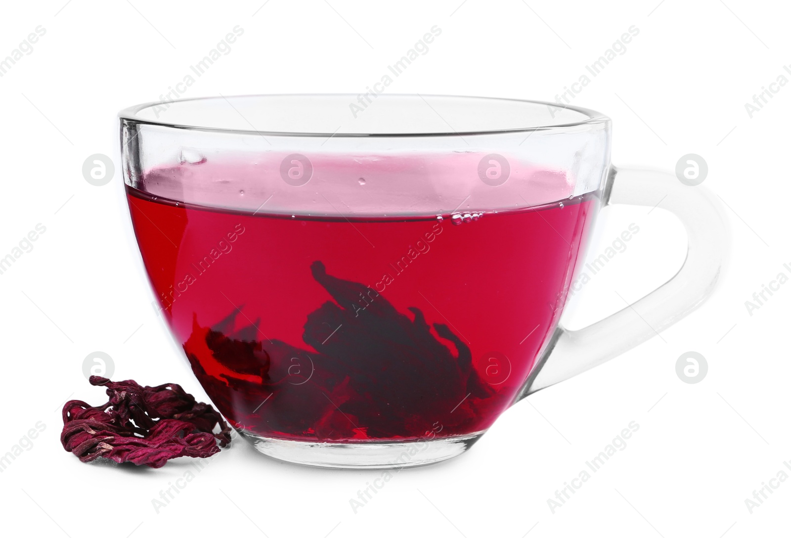 Photo of Delicious hibiscus tea in glass cup and dry roselle sepals isolated on white