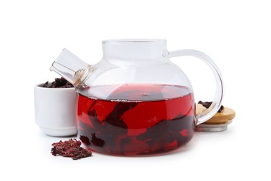 Photo of Delicious hibiscus tea in glass teapot and dry roselle sepals isolated on white