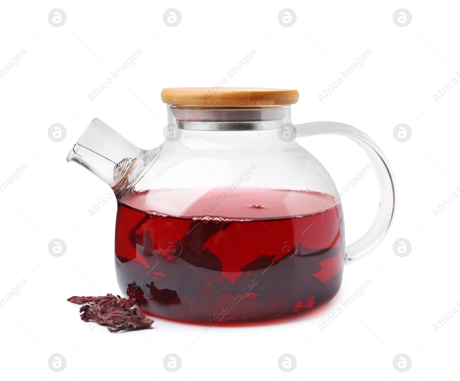 Photo of Delicious hibiscus tea in glass teapot and dry roselle sepals isolated on white