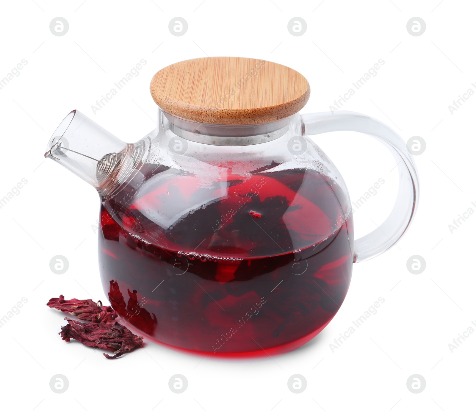 Photo of Delicious hibiscus tea in glass teapot and dry roselle sepals isolated on white