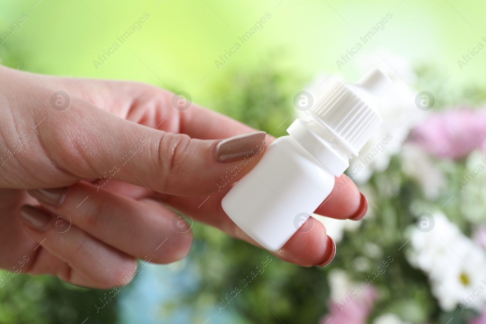 Photo of Allergy treatment. Woman with medical drops on blurred background, closeup