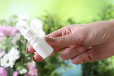 Photo of Allergy treatment. Woman with medical drops on blurred background, closeup