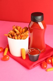 Photo of Tasty ketchup, tomatoes and fried carrots on color background