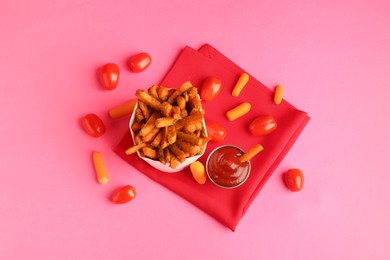 Photo of Tasty ketchup, tomatoes and fried carrots on pink background, flat lay