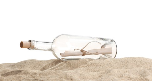 Photo of Rolled letter in corked glass bottle on sand against white background