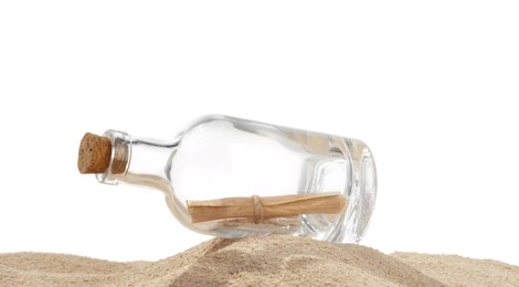 Photo of Rolled letter in corked glass bottle on sand against white background