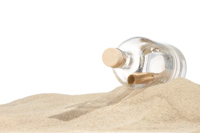 Photo of Rolled letter in corked glass bottle on sand against white background