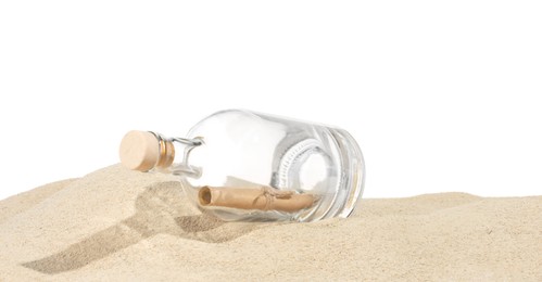 Photo of Rolled letter in corked glass bottle on sand against white background