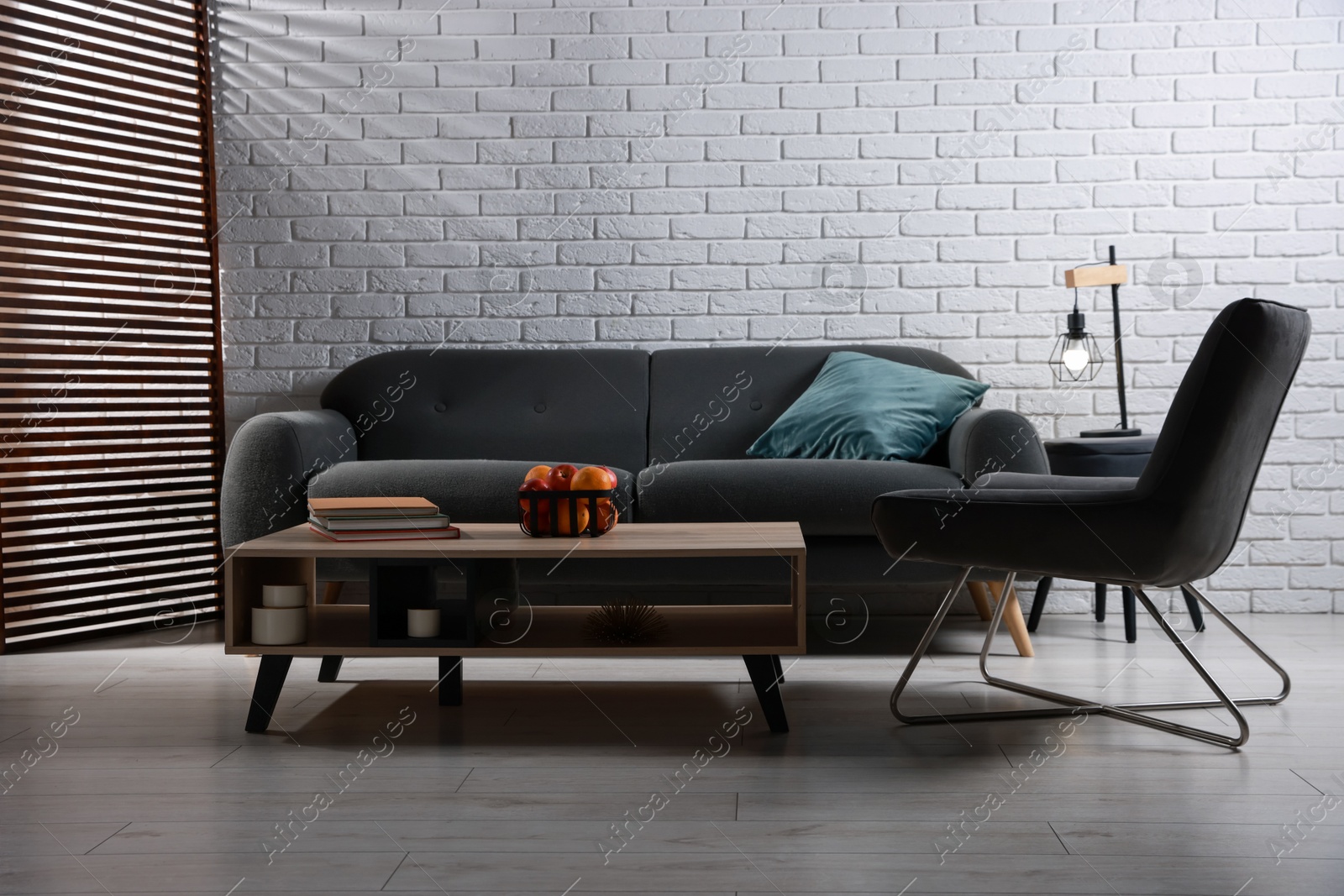 Photo of Comfortable sofa, armchair and coffee table in living room. Interior design