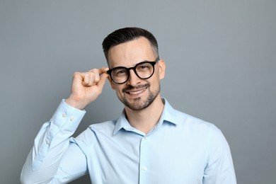 Photo of Portrait of handsome middle aged man on grey background