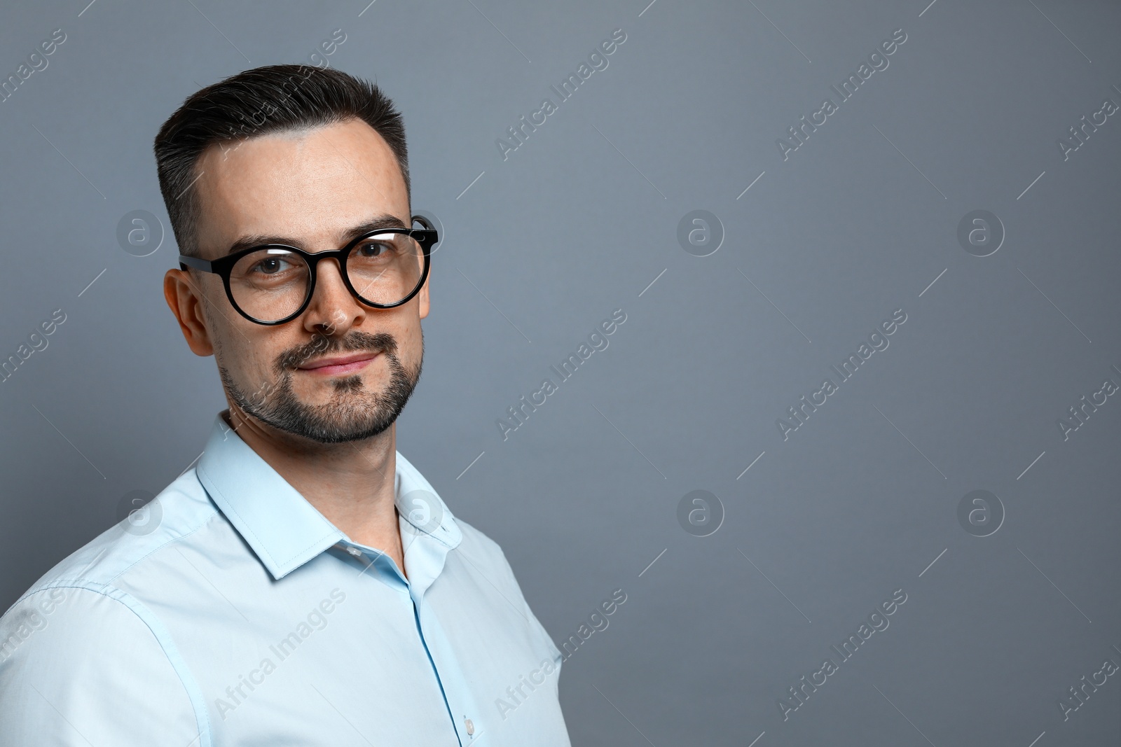 Photo of Portrait of handsome middle aged man on grey background, space for text