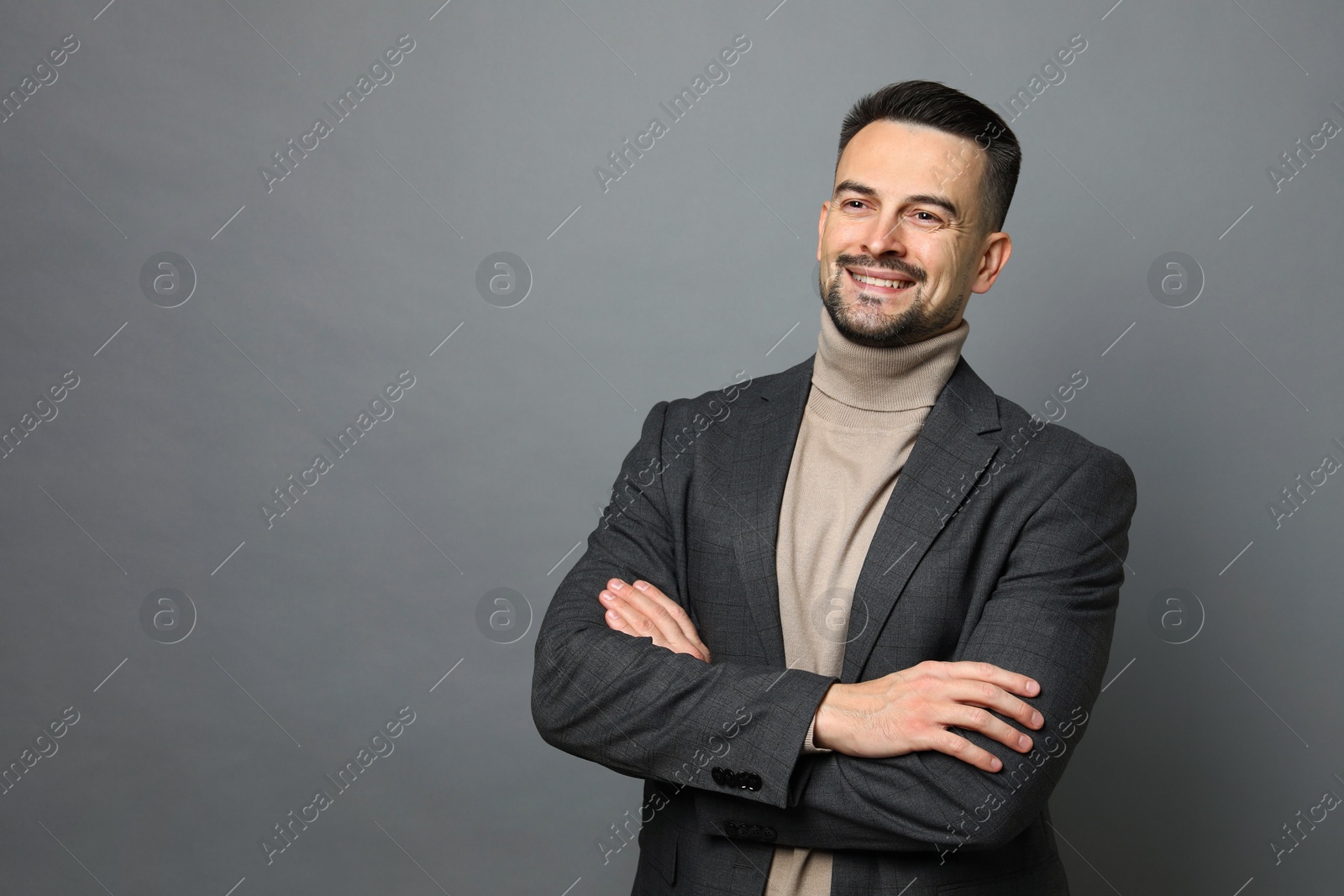 Photo of Portrait of handsome middle aged man on grey background, space for text