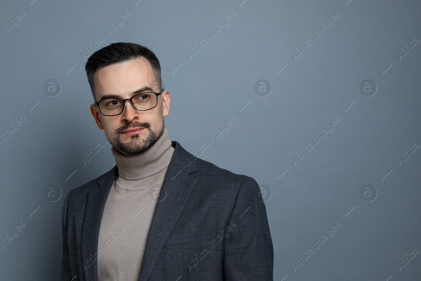 Photo of Portrait of handsome middle aged man on grey background, space for text