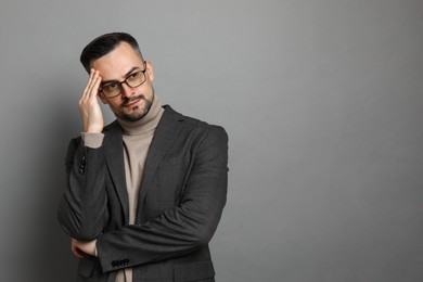 Photo of Portrait of handsome middle aged man on grey background, space for text