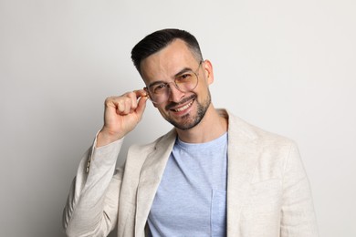 Photo of Portrait of handsome middle aged man on light background