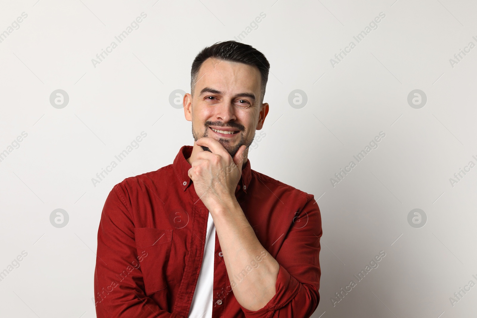 Photo of Portrait of handsome middle aged man on light background