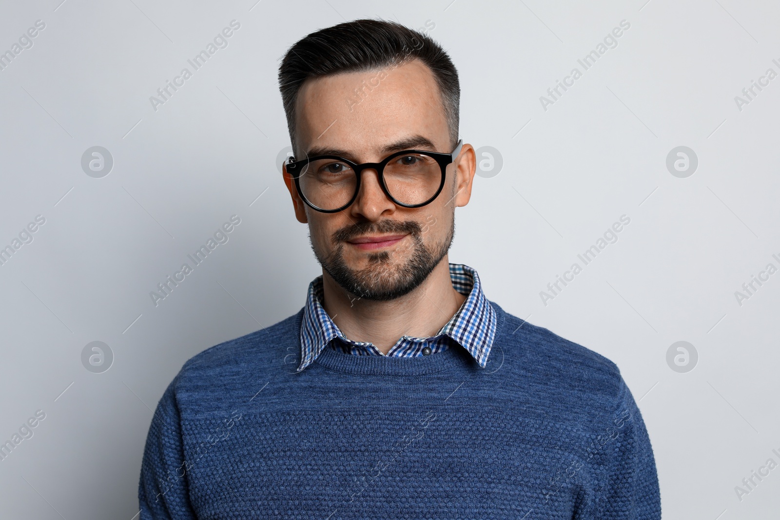 Photo of Portrait of handsome middle aged man on light background