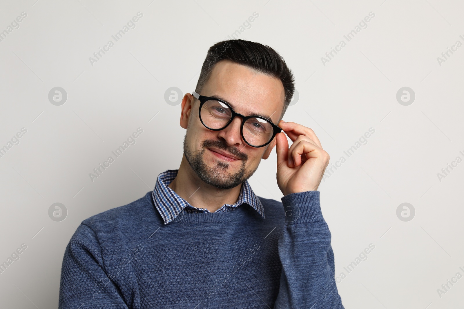 Photo of Portrait of handsome middle aged man on light background