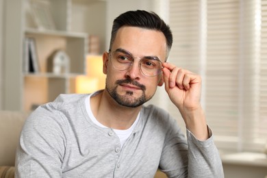 Photo of Portrait of handsome middle aged man indoors