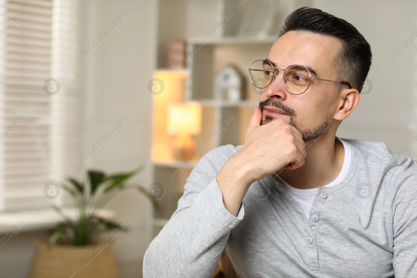 Photo of Portrait of handsome middle aged man indoors, space for text