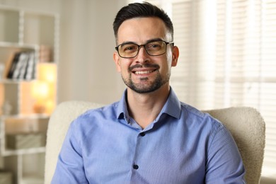 Photo of Portrait of handsome middle aged man indoors