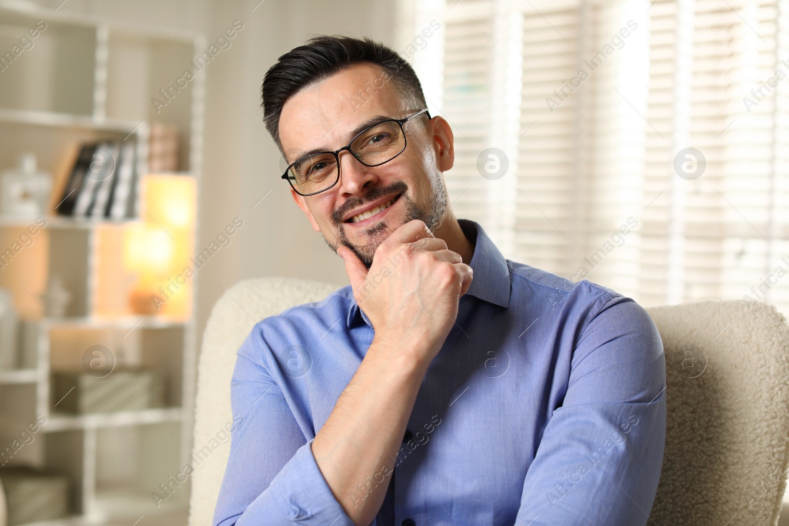 Photo of Portrait of handsome middle aged man indoors