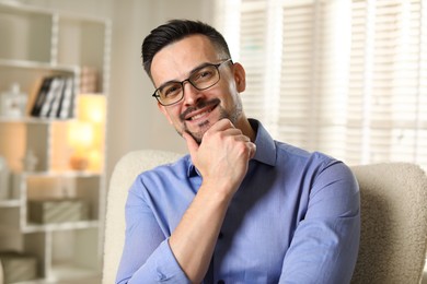 Photo of Portrait of handsome middle aged man indoors