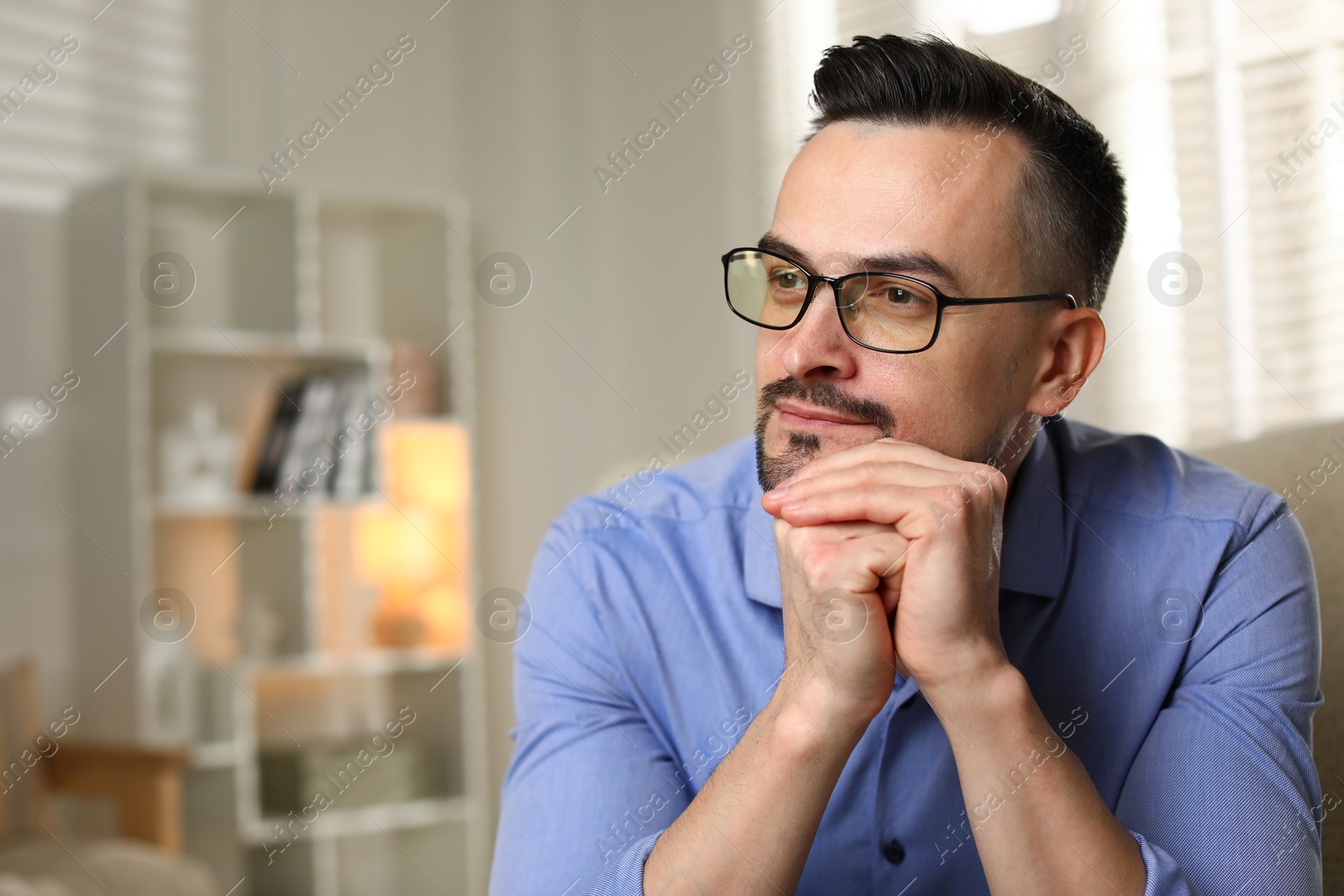 Photo of Portrait of handsome middle aged man indoors, space for text