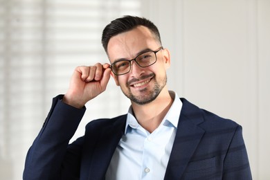 Portrait of handsome middle aged man indoors