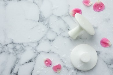 Photo of Wet spa stones and petals on white marble table, flat lay. Space for text