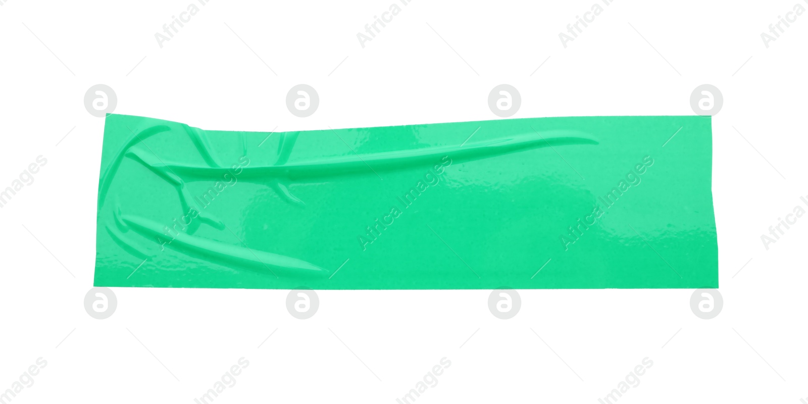 Photo of Strip of green adhesive tape isolated on white, top view