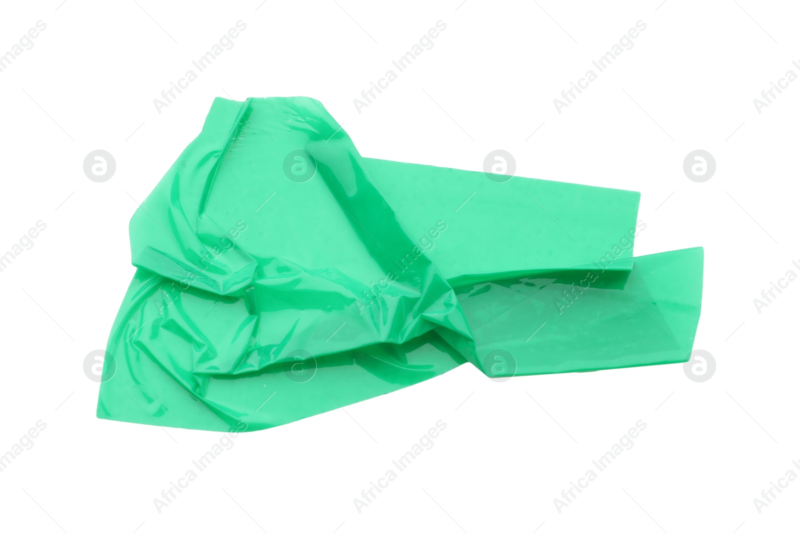 Photo of Strip of green adhesive tape isolated on white, top view