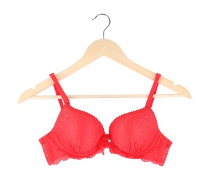 Photo of Beautiful red bra on hanger against white background