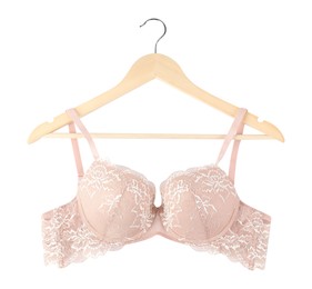 Photo of Beautiful beige bra on hanger against white background