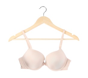 Photo of Beautiful beige bra on hanger against white background