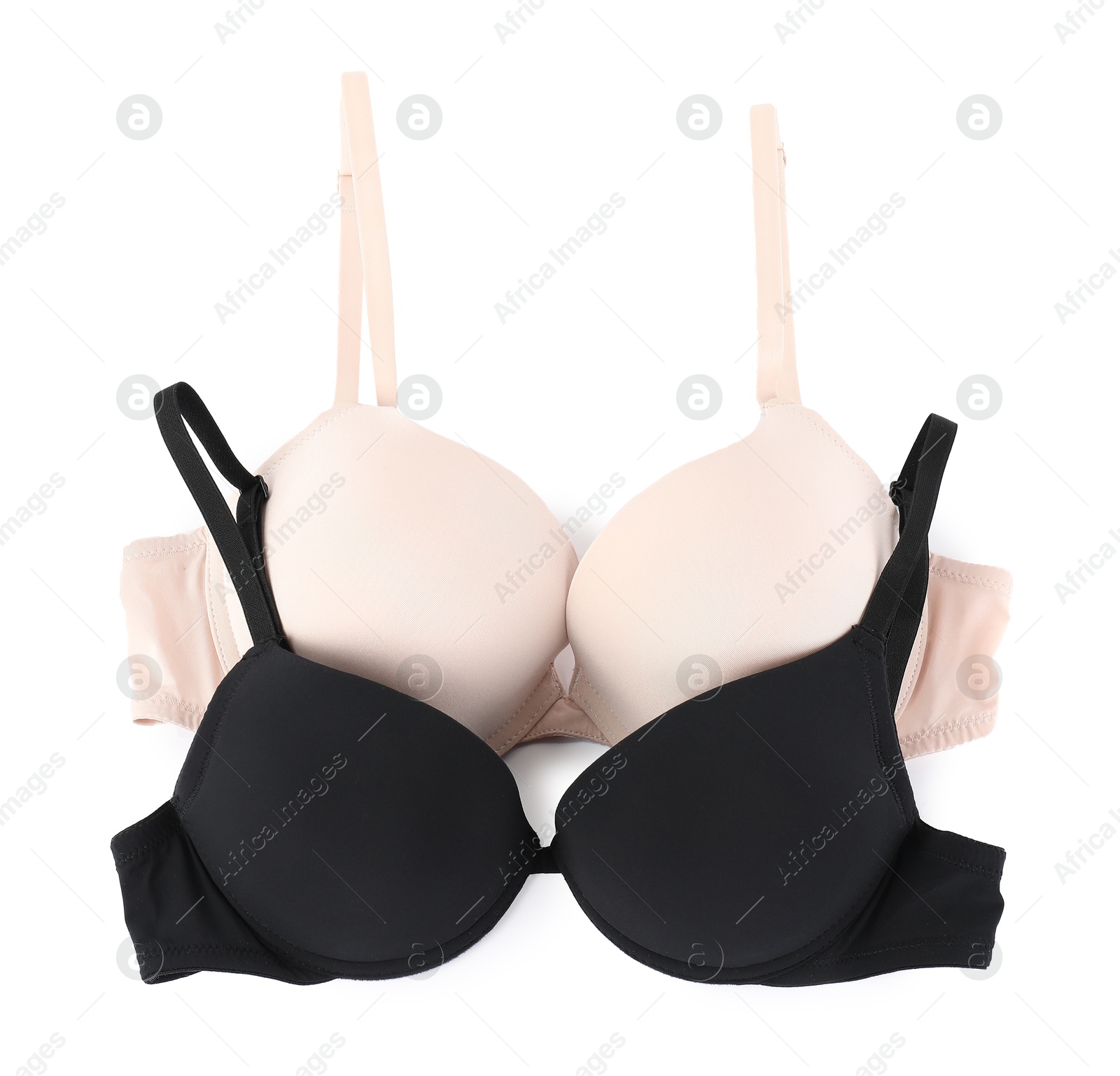 Photo of Two different beautiful bras isolated on white, top view