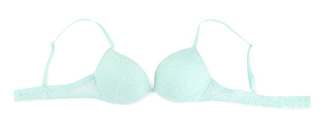 Photo of Beautiful turquoise bra isolated on white, top view