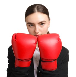 Photo of Competition. Businesswoman in suit wearing boxing gloves on white background