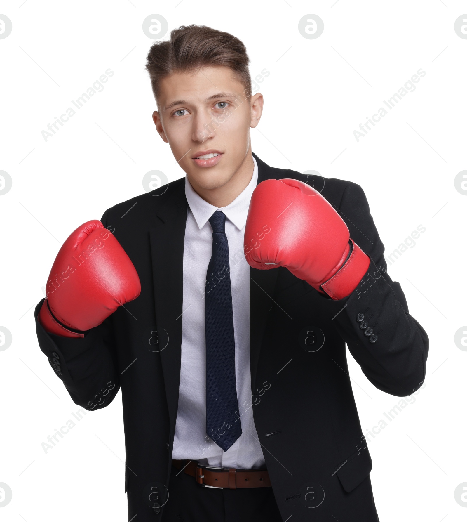 Photo of Competition. Businessman in suit wearing boxing gloves on white background