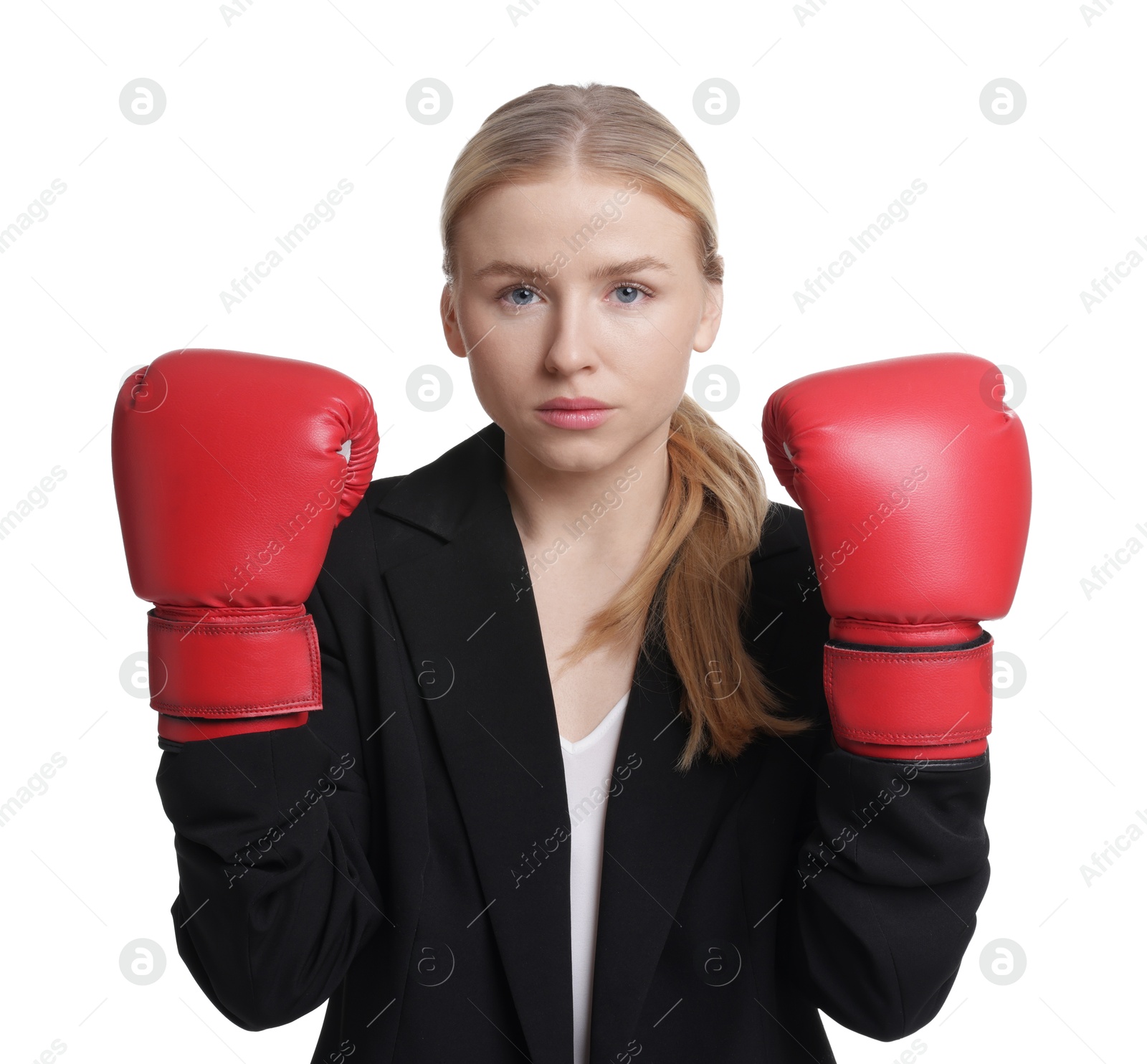 Photo of Competition. Businesswoman in suit wearing boxing gloves on white background