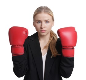 Photo of Competition. Businesswoman in suit wearing boxing gloves on white background