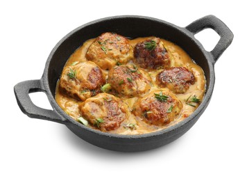 Photo of Delicious meatballs with gravy cream sauce and herbs isolated on white