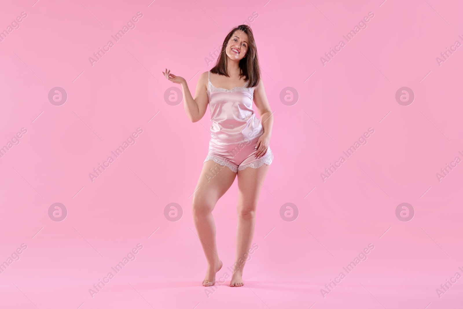 Photo of Woman in underwear on pink background. Cellulite problem