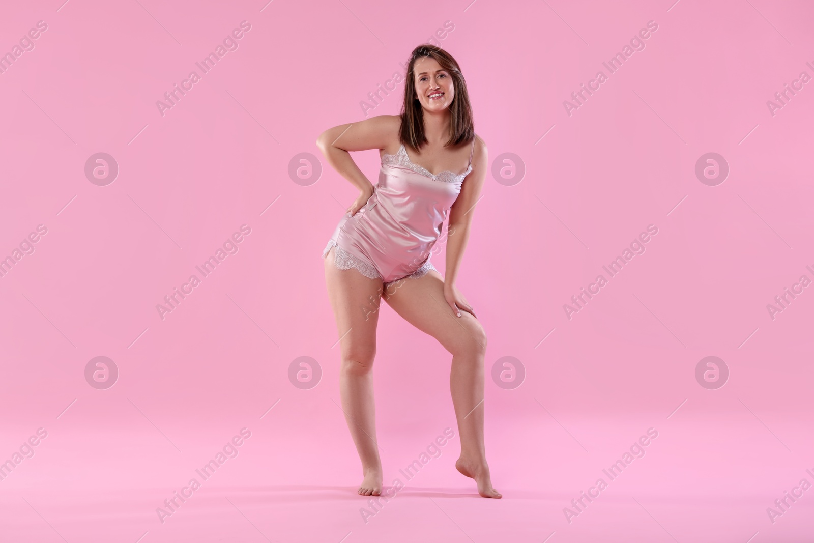 Photo of Woman in underwear on pink background. Cellulite problem