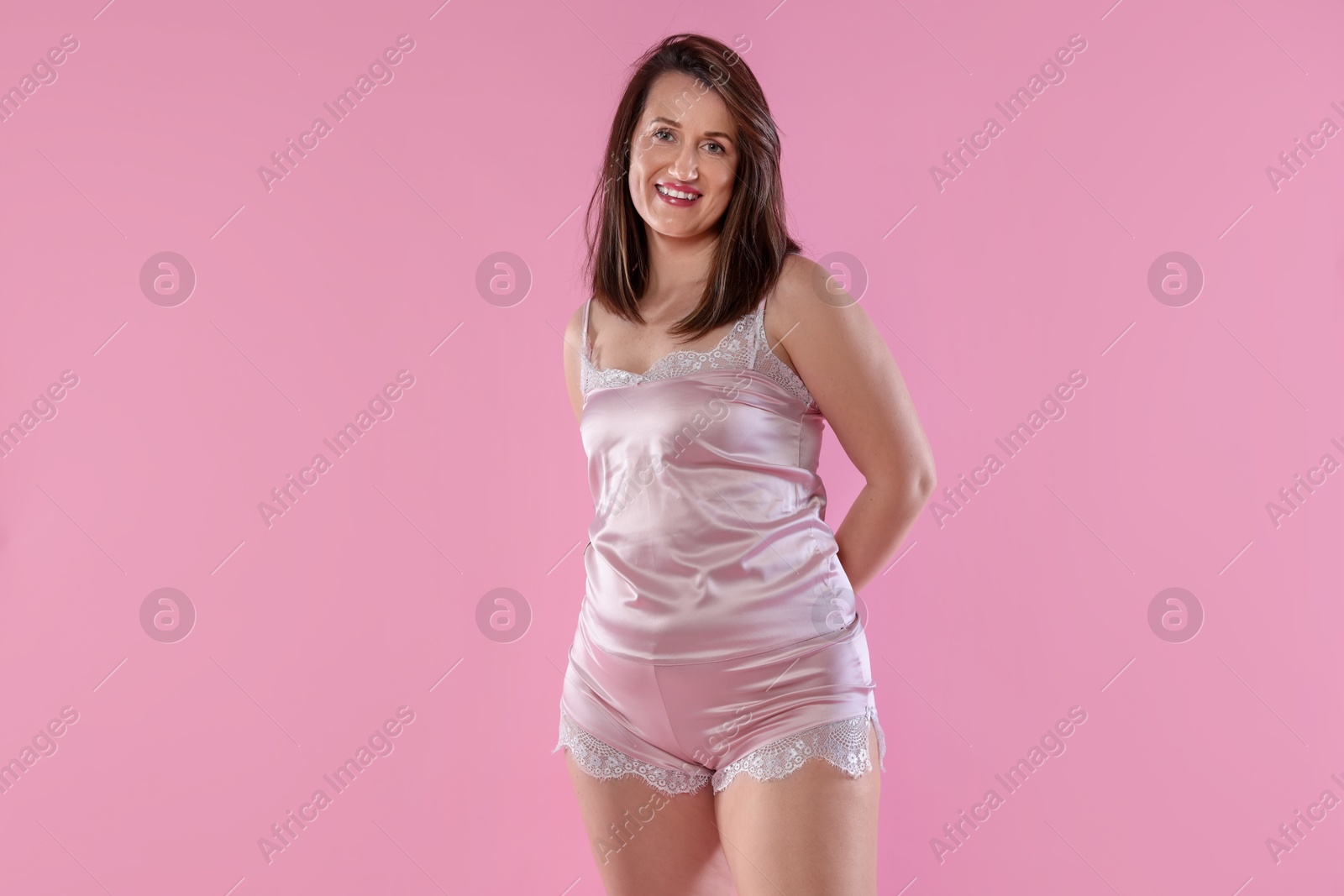 Photo of Woman in underwear on pink background. Cellulite problem